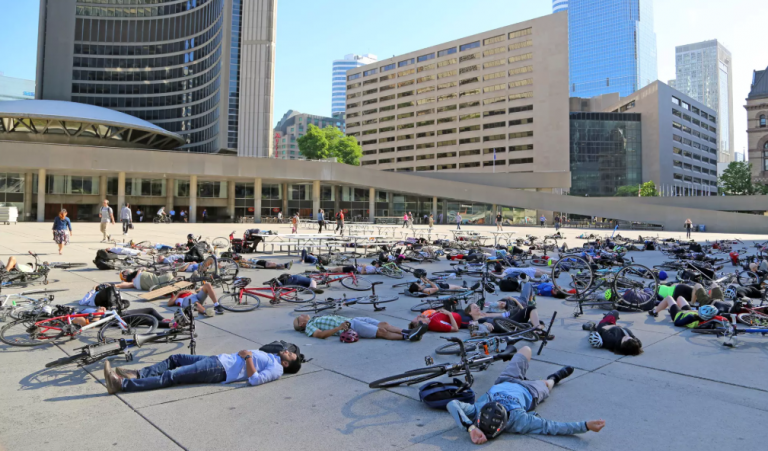 NEWS: Mass die-in staged outside Toronto City Hall